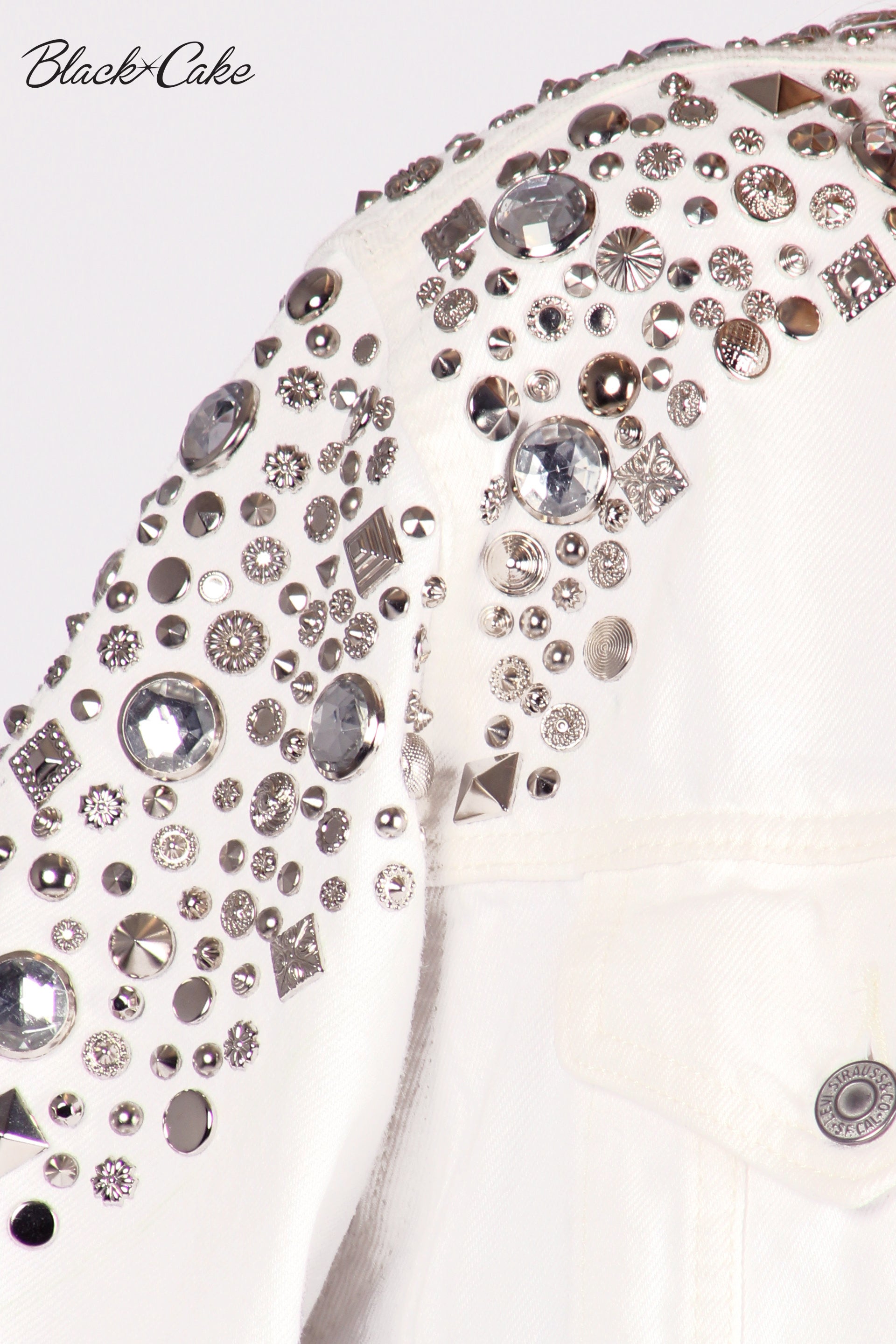 White Upcycled Rhinestone Studded Black Cake Hollywood Logo Jean Jacket by Black Cake Clothing